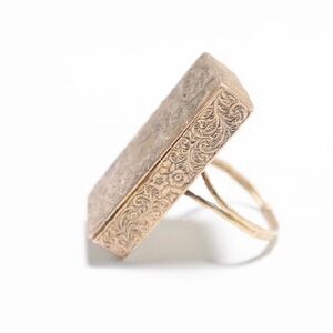 Antique hand chased match box holder in gold ring .